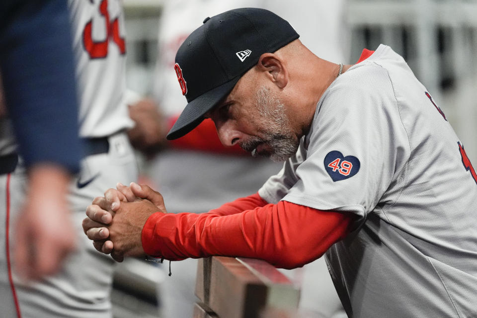 Boston Red Sox manager Alex Cora looks on from the dugout during in a baseball game against the Atlanta Braves Wednesday, May 8, 2024, in Atlanta. (AP Photo/John Bazemore)