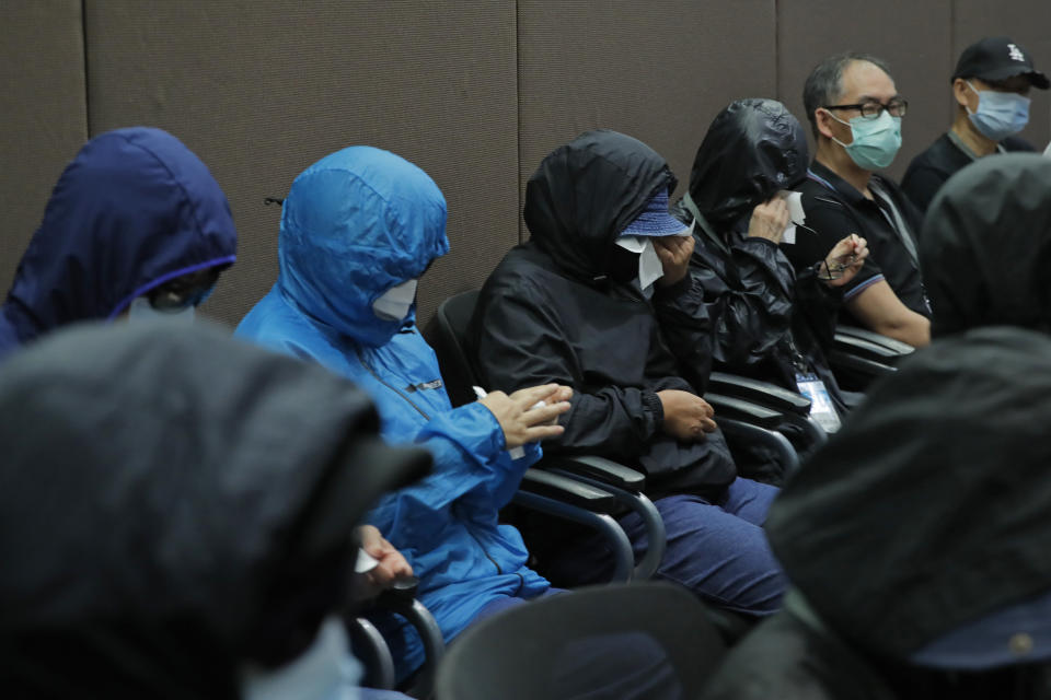 Relatives of 12 Hong Kong activists detained at sea by Chinese authorities attend a press conference in Hong Kong, Saturday, Sept. 12, 2020. They called for their family members to be returned to the territory, saying their legal rights were being violated. (AP Photo/Kin Cheung)