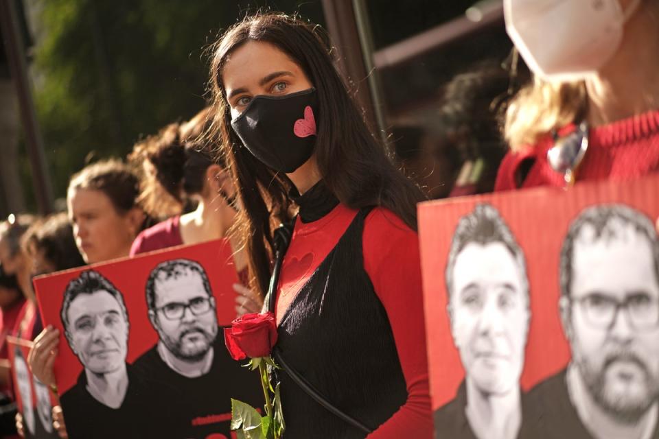 People take part in a vigil outside the Brazilian embassy (Victoria Jones/PA) (PA Wire)