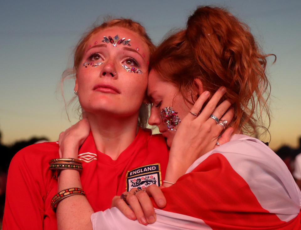 <p>England fan looks dejected after the match. REUTERS/Simon Dawson </p>