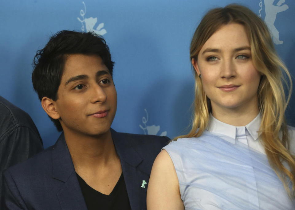 FILE - Tony Revolori, left, and Saoirse Ronan appear at the photo call for the film "The Grand Budapest Hotel" during the 64th Berlinale International Film Festival in Berlin on Feb. 6, 2014. Revolori appears n the latest Wes Anderson film, "Asteroid City." (Photo by Joel Ryan/Invision/AP, File)
