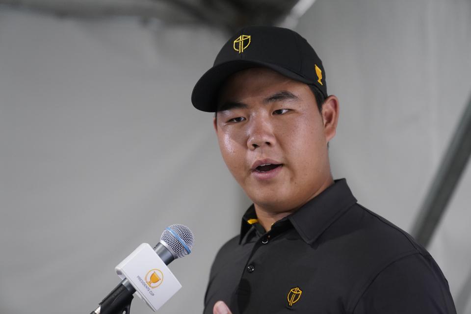 Tom Kim, of South Korea, speaks during a news conference after practice for the Presidents Cup golf tournament at the Quail Hollow Club, Tuesday, Sept. 20, 2022, in Charlotte, N.C. (AP Photo/Chris Carlson)