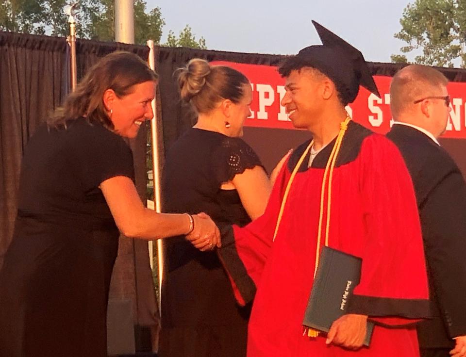 Elmira High School graduating senior Wyatt Moss accepts congratulations after receiving his diploma Thursday, June 20, 2024 during the high school's commencement ceremony.