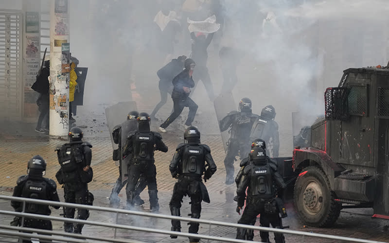 University students and police clash after an April 28 demonstration commemorating last year’s national strike against a government-proposed tax reform turned violent in Bogota, Colombia. <em>Associated Press/Fernando Vergara</em>
