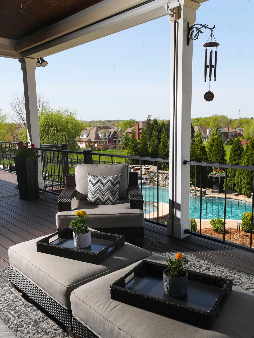 A large in-ground pool with waterfall makes for an inviting retreat as the second level deck offers plenty of space for relaxing.