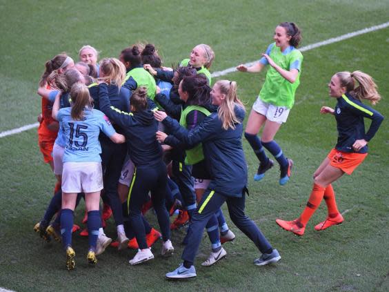 Manchester City Women celebrate after securing victory in the penalty shoot-out (Getty)