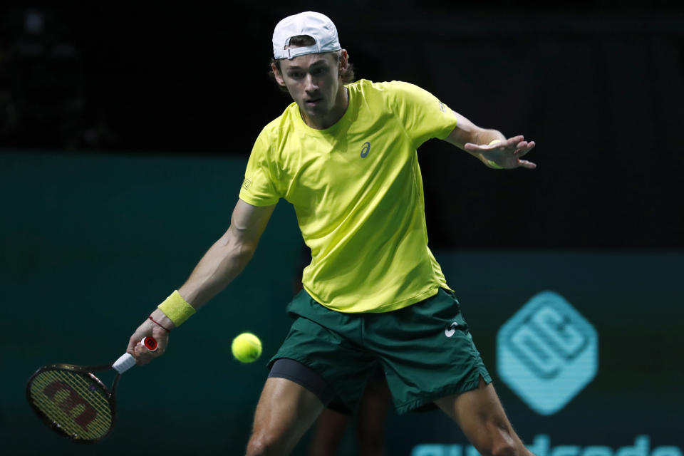 Australia's Alex de Minaur returns the ball to Canada's Felix Auger Aliassime during the final Davis Cup tennis match between Australia and Canada in Malaga, Spain, Sunday, Nov. 27, 2022. (AP Photo/Joan Monfort)