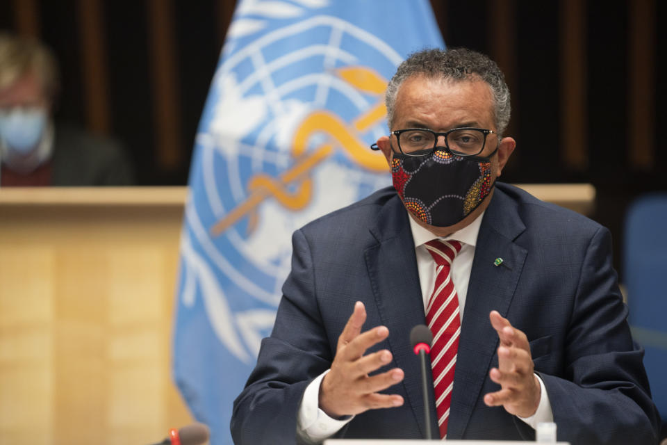 In this photo released by WHO, World Health Organisation on Monday, Oct. 5, 2020, WHO Director-General, Dr Tedros Adhanom Ghebreyesus, wearing a mask to protect against coronavirus, gestures during a special session on the COVID-19 respnse. The head of emergencies at the World Health Organization says its “best estimates” indicate that roughly 1 in 10 people worldwide may have been infected by the coronavirus. (Christopher Black/WHO via AP)