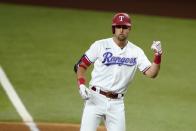 Texas Rangers' Nate Lowe celebrates as he stands on first after hitting an RBI single in the fourth inning of the team's baseball game against the Arizona Diamondbacks in Arlington, Texas, Wednesday, July 28, 2021.(AP Photo/Tony Gutierrez)