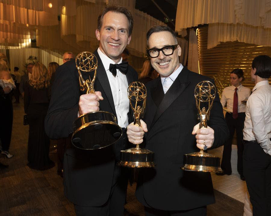 (Left to Right) Luke Lloyd-Davies and David Furnish (Elton John’s husband), two of the winning executive producers of “Elton John Live,” display their Emmy Awards at The Walt Disney Company Post-Emmys Celebration at Otium in Los Angeles. (Disney/Stewart Cook)