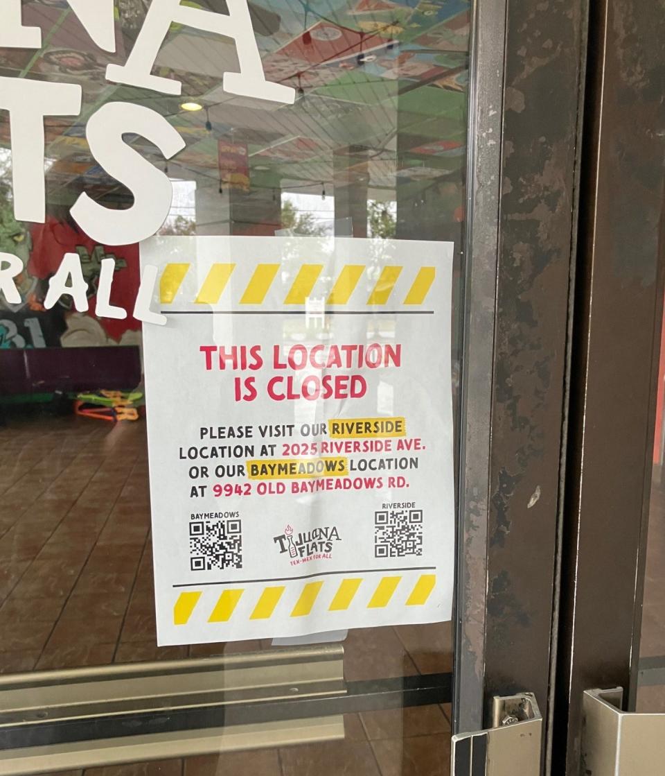 A sign taped to the front door of Tijuana Flats' restaurant at 5635 San Jose Blvd announces the restaurant's closure and refers customers to nearby locations.
