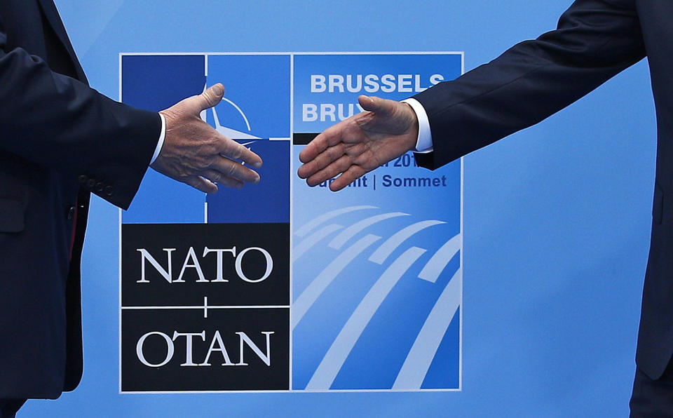 FILE - In this Wednesday, June 11, 2018 file photo, U.S. President Donald Trump, left, is greeted by NATO Secretary General Jens Stoltenberg at NATO headquarters in Brussels. In normal times, the United States would use its weight to bring NATO partners into line, but the naval standoff between France and Turkey is shining a spotlight on NATO's struggle to keep its ranks in order and underscores the limits of the organization. (AP Photo/Francois Mori, File)