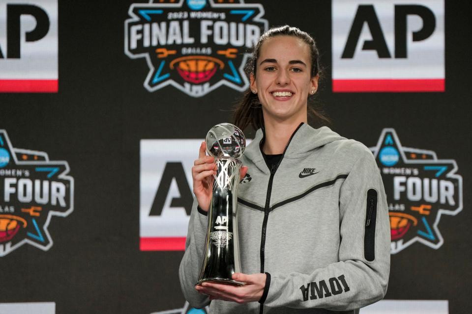 Iowa Hawkeyes guard Caitlin Clark poses for a photo after accepting the Associated Press Player of the Year award at American Airlines Center in Dallas.