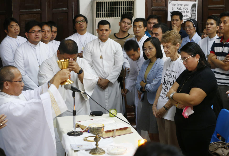 Australian Roman Catholic nun Sister Patricia Fox, second from right front row, attends a mass hours before her departure for Australia Saturday, Nov. 3, 2018 in suburban Quezon city, northeast of Manila, Philippines. Sister Fox decided to leave after 27 years in the country after the Immigration Bureau denied her application for the extension of her visa. The Philippine immigration bureau has ordered the deportation of Fox who has angered the president by joining anti-government rallies. (AP Photo/Bullit Marquez)