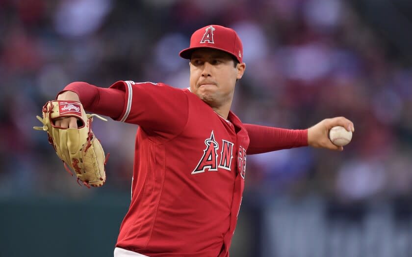 FILE - In this May 25, 2019, file photo, Los Angeles Angels starting pitcher Tyler Skaggs throws during the first inning of a baseball game against the Texas Rangers in Anaheim, Calif. The Angels say they do not know whether a longtime public relations official had been providing drugs to late pitcher Skaggs, as detailed in a report on ESPN's "Outside the Lines." Eric Kay, a 24-year employee of the Angels' PR department, told the Drug Enforcement Agency he had provided opioids to Skaggs and used them with the pitcher for years, according to the ESPN report Saturday, Oct. 12, 2019. Kay reportedly watched as Skaggs snorted three lines of crushed pills in his hotel room in Texas, on the night before he was found dead. (AP Photo/Mark J. Terrill, File)