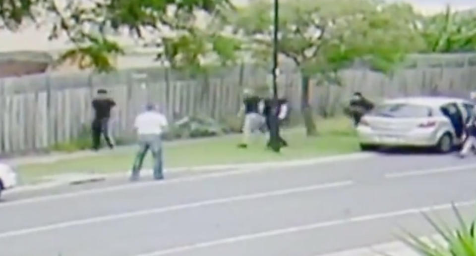 The man, who hasn’t been named, was filmed arming himself with a baseball bat in Roxburgh Park on Sunday against a group of young men before being bashed with a piece of wood. Source: 7 News
