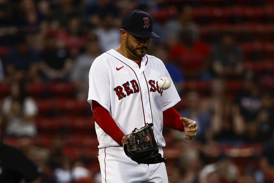 Boston Red Sox starting pitcher Martin Perez tosses the ball out from his glove after giving up a run to the Houston Astros during the second inning of a baseball game Tuesday, June 8, 2021, at Fenway Park in Boston. (AP Photo/Winslow Townson)