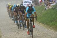 Astana rider Vincenzo Nibali of Italy cycles on a cobble-stoned section during the 223.5-km (138.9 miles) 4th stage of the 102nd Tour de France cycling race from Seraing in Belgium to Cambrai, France, July 7, 2015. REUTERS/Bernard Papon/Pool