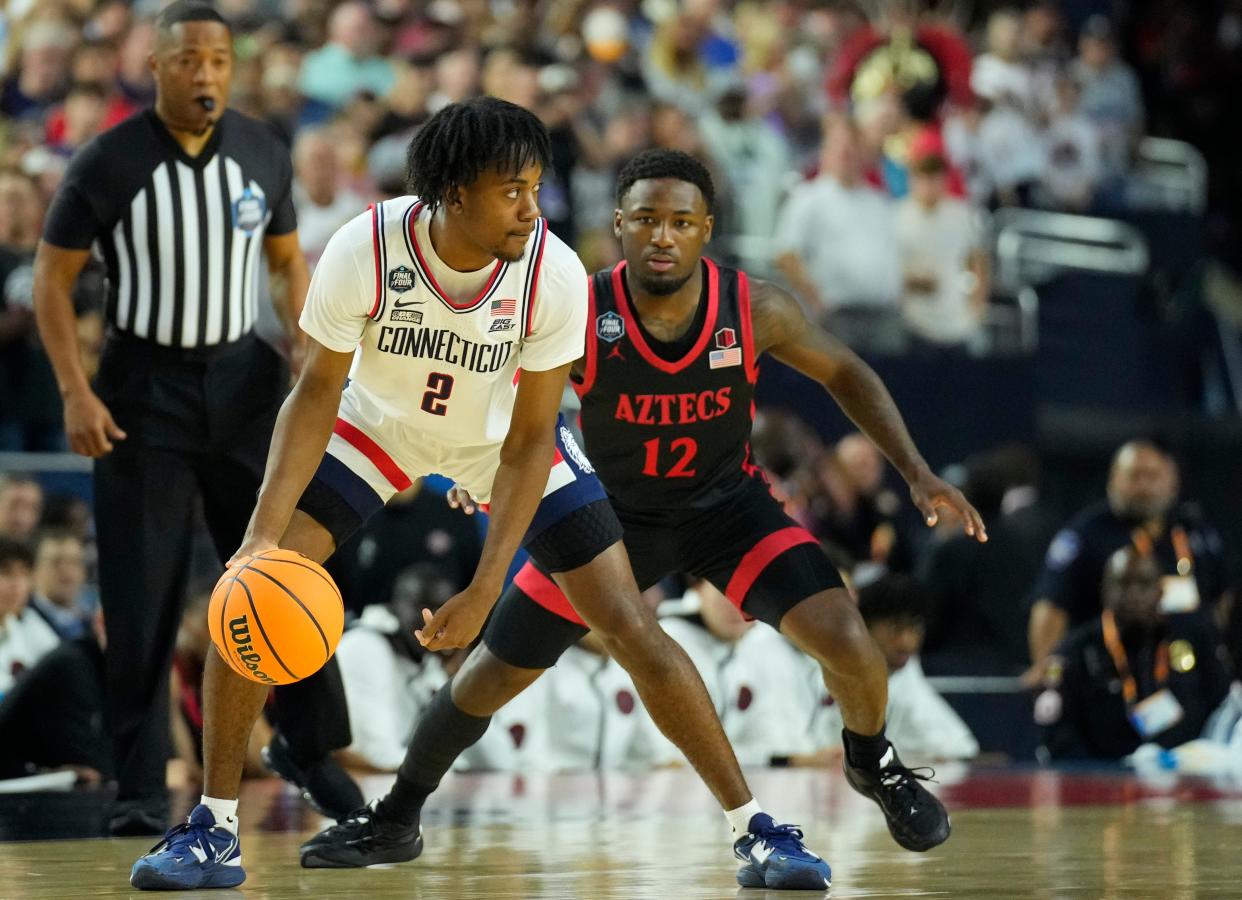 Connecticut Huskies guard Tristen Newton (2) dribbles against San Diego State's Darrion Trammell.