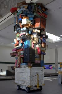 Tons of luggage reaching the ceiling 