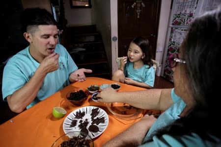 Biologist Paniagua and family eat insects while promoting the ingestion of a wide variety of insects as low-cost and nutrient-rich food in Grecia