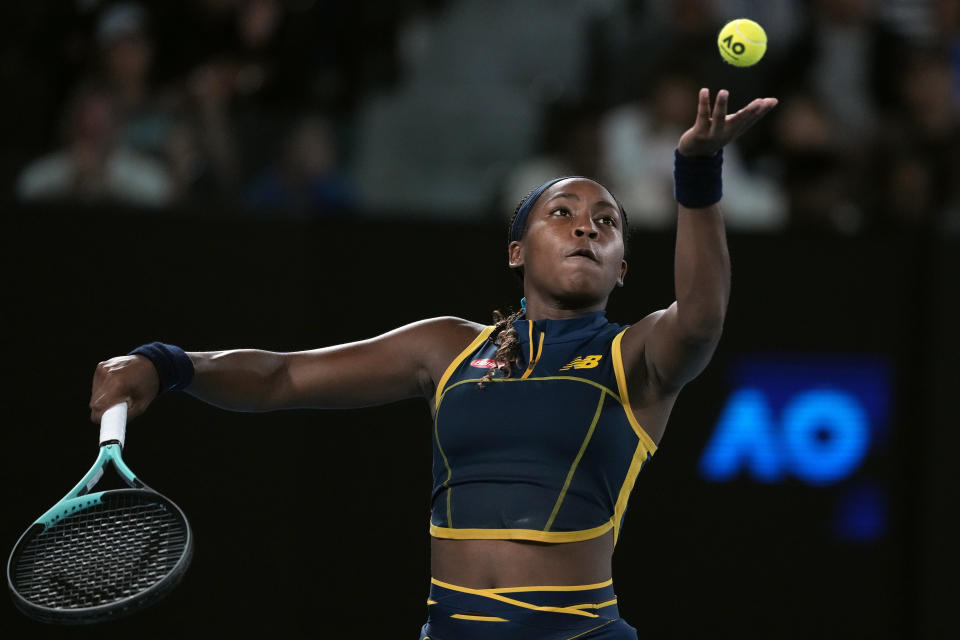 Coco Gauff of the U.S. serves to Aryna Sabalenka of Belarus during their semifinal match at the Australian Open tennis championships at Melbourne Park, Melbourne, Australia, Thursday, Jan. 25, 2024. (AP Photo/Alessandra Tarantino)