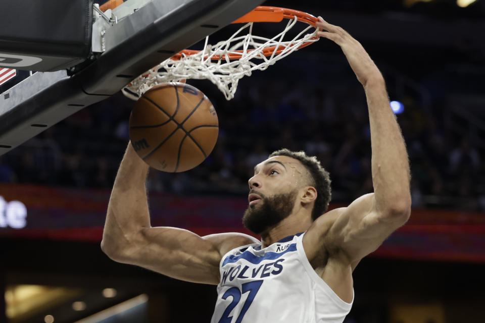 Minnesota Timberwolves center Rudy Gobert dunks against the Orlando Magic during the first half of an NBA basketball game Wednesday, Nov. 16, 2022, in Orlando, Fla. (AP Photo/Kevin Kolczynski)