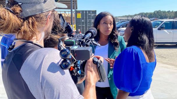 PHOTO: ABC congressional correspondent Rachel Scott (center) talks with ABC News embedded campaign reporter Lalee Ibssa (right) at a Herschel Walker rally in Wadley, Georgia. (ABC News)