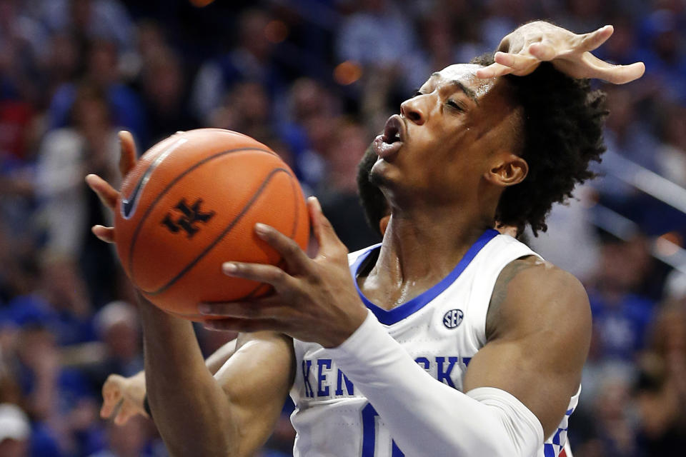 Kentucky's Ashton Hagans (0) shoots while pressured from behind by Alabama's Galin Smith during the first half of an NCAA college basketball game in Lexington, Ky., Saturday, Jan 11, 2020. Kentucky on 76-67. (AP Photo/James Crisp)