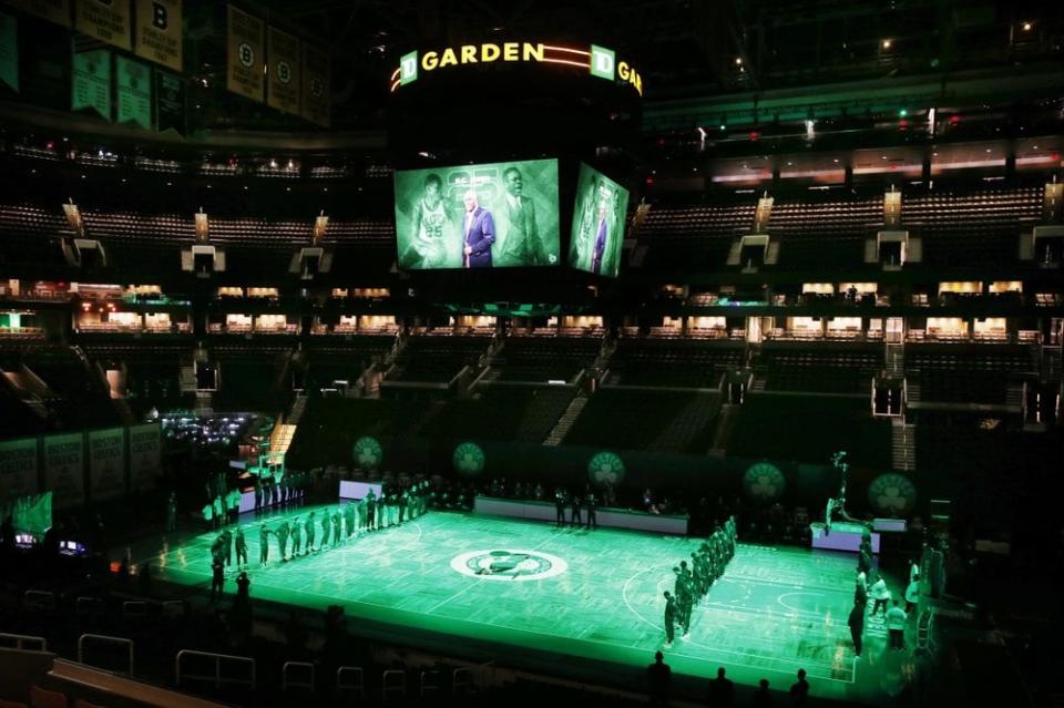The Boston Celtics and the Brooklyn Nets observe a moment of silence for K.C. Jones before an NBA basketball game, Friday, Dec. 25, 2020, in Boston. (AP Photo/Michael Dwyer)