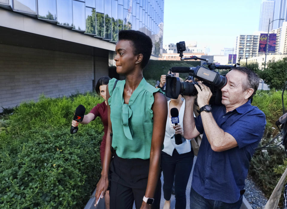 Adau Mornyang surrounded by media arriving at a court in Los Angeles in July. Source: AAP