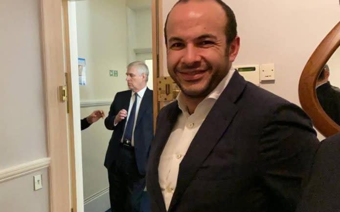 Prince Andrew (in the background) at a dinner at the South Kensington home of Mr Turk (foreground) in December 2019
