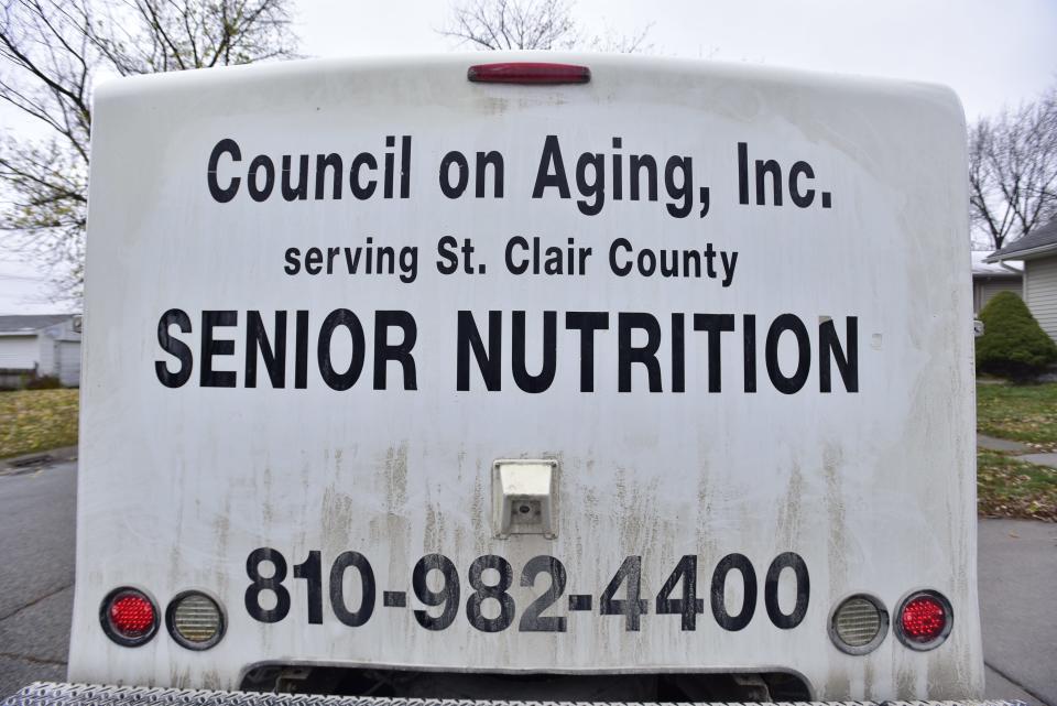 The Council on Aging truck parks on the side of a residential street during a meal delivery to clients on the west side of the city on Wednesday, Nov. 16, 2022. The Thumb Food Policy Council  —  a nonprofit that serves St. Clair, Sanilac, Tuscola, Huron and Lapeer counties  —  recently received an $852,000 grant funded through the U.S. Department of Agriculture and administered through the Michigan Department of Education to develop food delivery strategies for the region's most vulnerable populations.