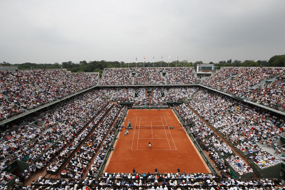 FILE -The crowd watch Austria's Dominic Thiem serving to Spain's Rafael Nadal during the men's final match of the French Open tennis tournament at the Roland Garros stadium, in Paris, June 10, 2018. The French Open starts Sunday at Roland Garros. (AP Photo/Christophe Ena, File)