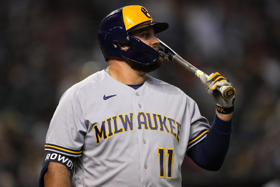 Milwaukee Brewers' Rowdy Tellez (11) walks to the dugout after automatically striking out on a clock violation during the seventh inning of a baseball game against the Arizona Diamondbacks, Monday, April 10, 2023, in Phoenix. (AP Photo/Matt York)