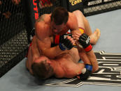 LAS VEGAS, NV - MAY 26: CB Dollaway (top) punches Jason Miller during a middleweight bout at UFC 146 at MGM Grand Garden Arena on May 26, 2012 in Las Vegas, Nevada.