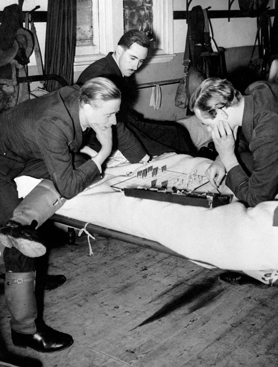 File photo dated 01/09/40 of RAF Fighter pilots resting while waiting for the 'Squadron Scramble' to go into action against the German Luftwaffe during the Battle of Britain.