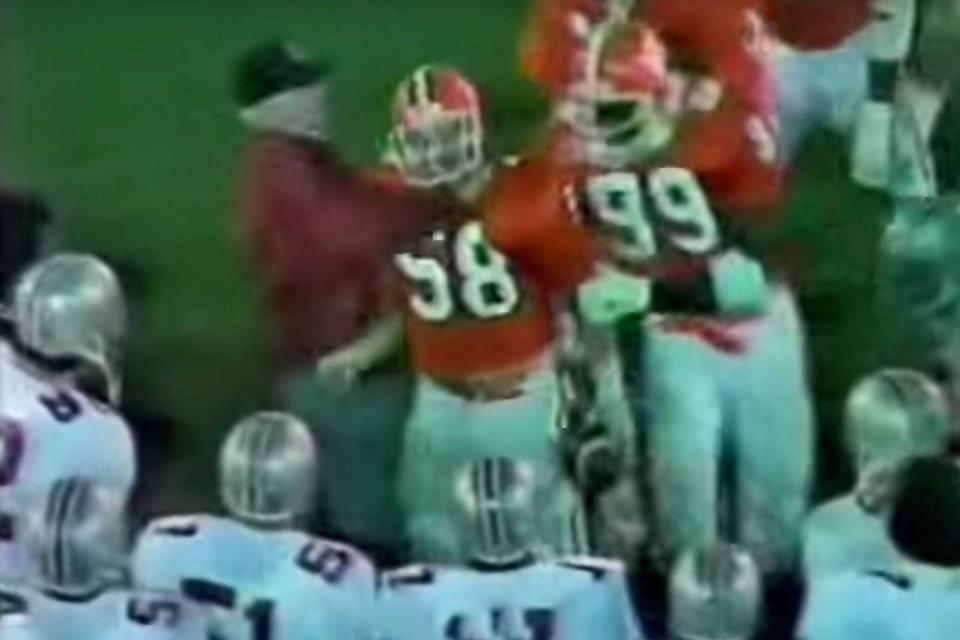 A photo shot from an ABC monitor shows the moment Ohio State coach Woody Hayes make contact with Clemson linebacker Charlie Bauman during the 1979 Gator Bowl.