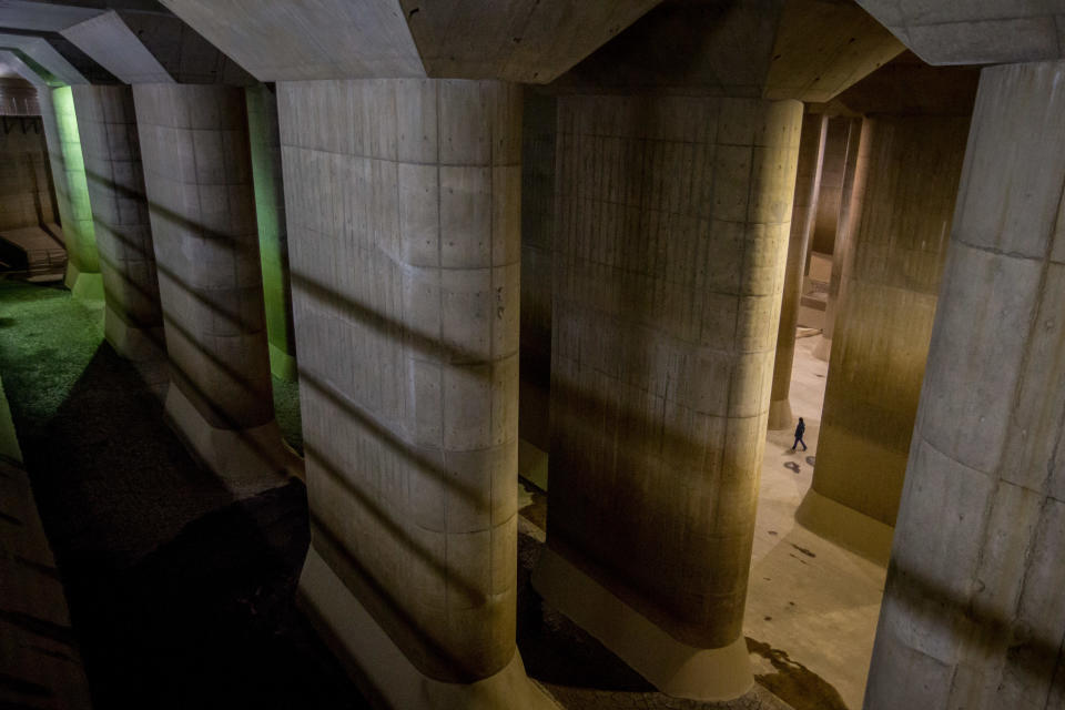 Metropolitan Area Outer Floodway management office chief Oosu Eiichi is seen in the pressure-adjusting underground water tank during a tour of the Metropolitan Area Outer Underground Discharge Channel facility, April 8, 2015 in Tokyo, Japan. / Credit: Chris McGrath/Getty