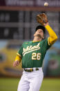 Oakland Athletics third baseman Matt Chapman catches a pop foul by Texas Rangers' Yonny Hernandez during the fifth inning of a baseball game Friday, Aug. 6, 2021, in Oakland, Calif. (AP Photo/D. Ross Cameron)