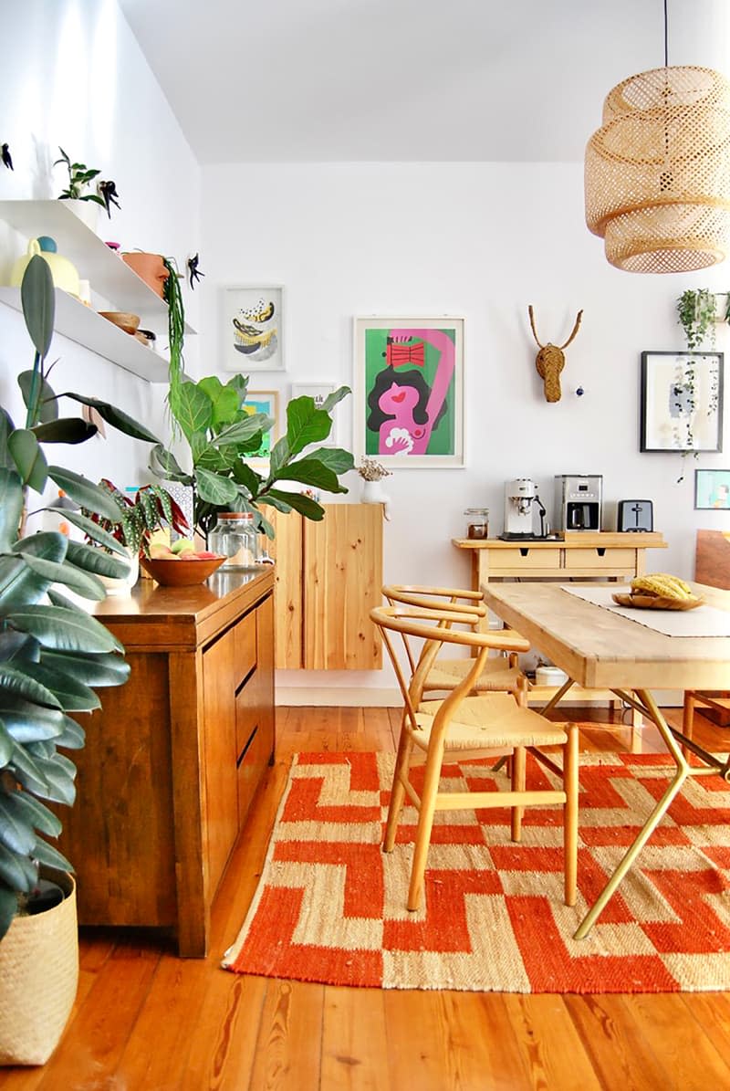 White dining room with art.