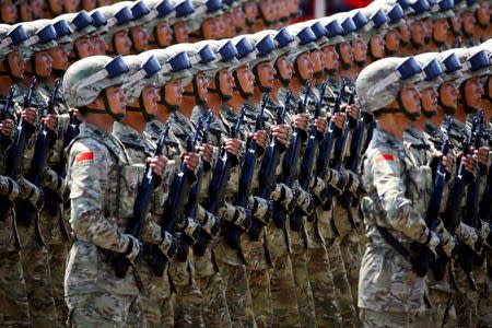 China's People's Liberation Army soldiers march with their weapons at Tiananmen Square during the military parade marking the 70th anniversary of the end of World War Two, in Beijing September 3, 2015. REUTERS/Damir Sagolj