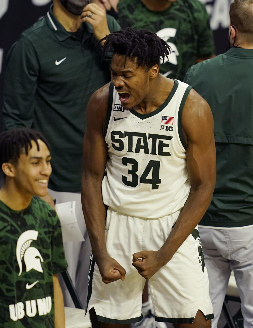 Michigan State forward Julius Marble II reacts after a play from a teammate during the second half of an NCAA college basketball game against Michigan, Sunday, March 7, 2021, in East Lansing, Mich. (AP Photo/Carlos Osorio)