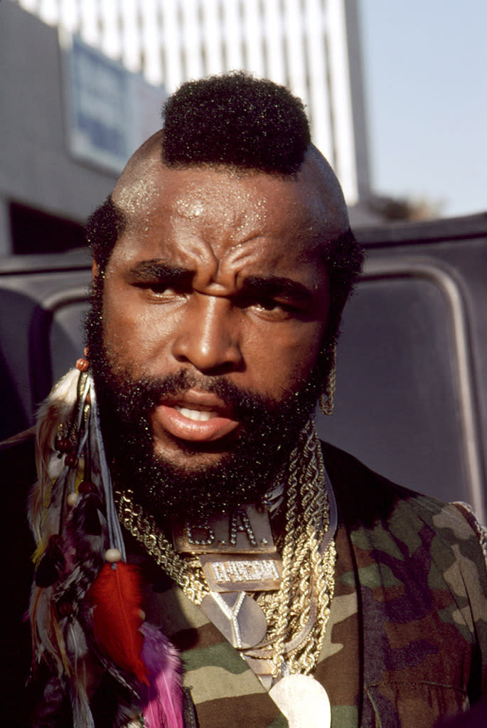 THEN: <a href="http://movies.yahoo.com/movie/contributor/1800052740" data-ylk="slk:MR. T;elm:context_link;itc:0;sec:content-canvas" class="link ">MR. T</a> With a Mohawk haircut copied out of "National Geographic" and countless gold chains (reportedly worth $300,000 at the time), Laurence Tureaud transformed himself into Mr. T. Spotted by Sylvester Stallone on a TV competition, he was cast as Clubber Lang in "Rocky III." The movie launched both his acting career and his catchphrase: "I pity the fool." At the height of his fame, Mr. T had his own action figures, records, Saturday morning cartoon show, and breakfast cereal (enjoyed by Pee Wee Herman in his "Big Adventure"). After "The A-Team" ended, he never really left the public eye, appearing in commercials and on TV shows, usually as himself. Mr. T was diagnosed with T-cell lymphoma in 1995, but after treatment he has been healthy for nearly a decade. He scored the biggest box-office hit of his career last year as a voice in the animated "Cloudy With a Chance of Meatballs." He turned down the offer to cameo in the new "A-Team" movie. He said he <a href="http://www.latinoreview.com/news/exclusive-sorry-fans-mr-t-will-not-appear-in-the-a-team-remake-8869" rel="nofollow noopener" target="_blank" data-ylk="slk:didn't object to the remake;elm:context_link;itc:0;sec:content-canvas" class="link ">didn't object to the remake</a>, but that it just didn't interest him. There were reports that Mr. T had derided the movie for being "too graphic," but <a href="http://popwatch.ew.com/2010/06/10/mr-t-a-team-movie-denies-graphic/" rel="nofollow noopener" target="_blank" data-ylk="slk:his lawyer stated;elm:context_link;itc:0;sec:content-canvas" class="link ">his lawyer stated</a> that he had not seen it and would not comment on it.