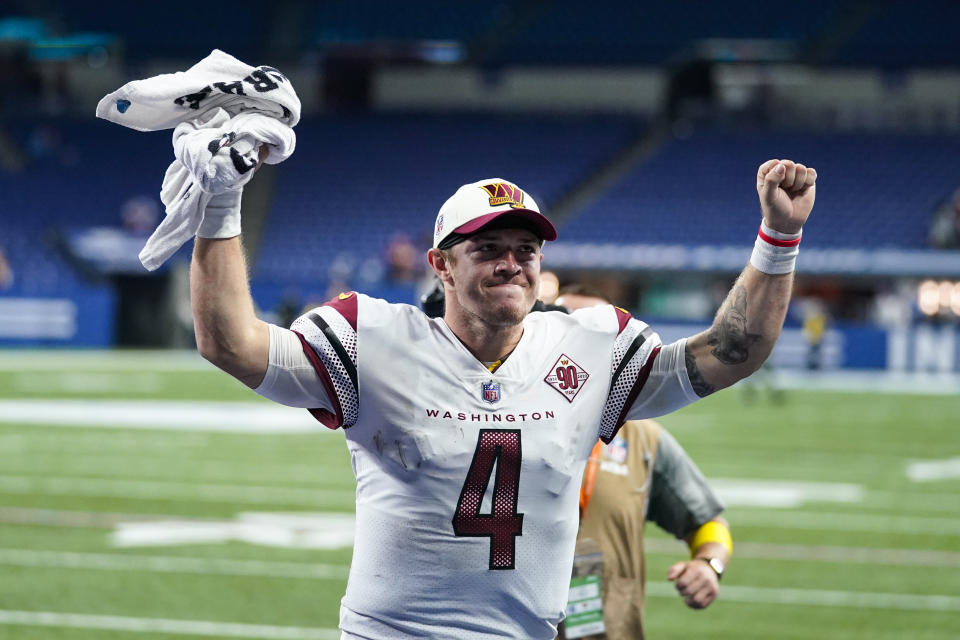 Washington Commanders quarterback Taylor Heinicke (4) celebrates as he leaves the field following an NFL football game against the Indianapolis Colts in Indianapolis, Fla., Sunday, Oct. 30, 2022. The Commanders defeated the Colts 17-16. (AP Photo/Darron Cummings)