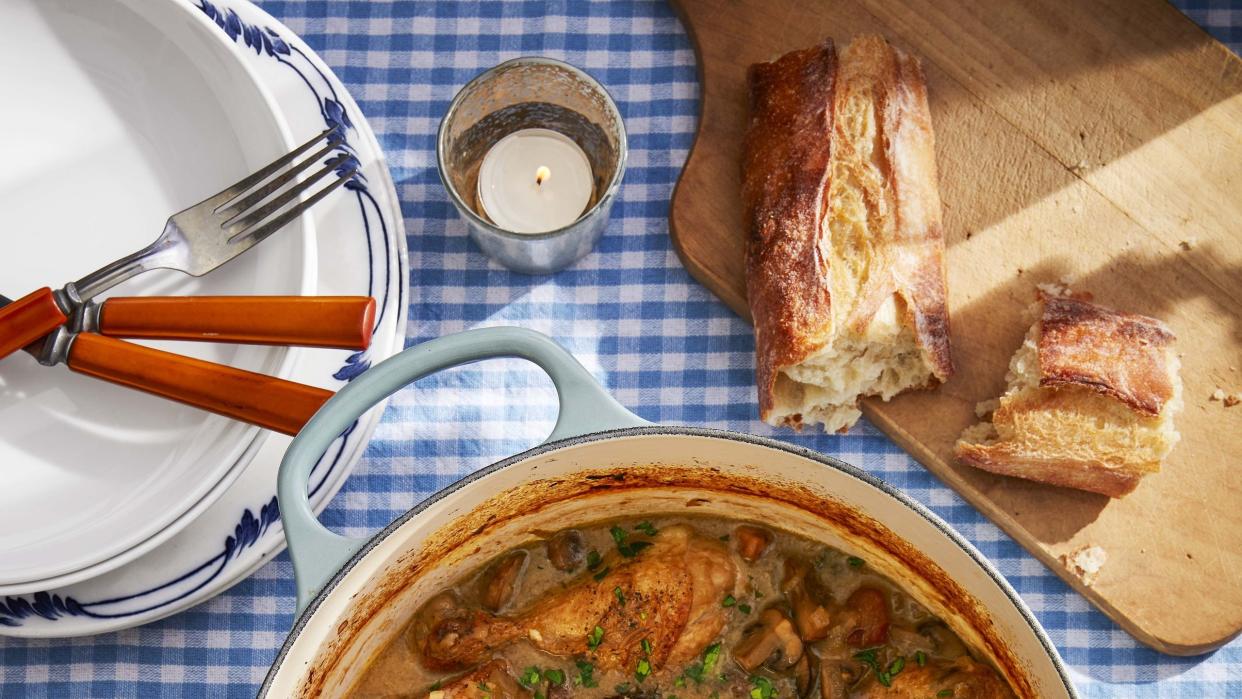 white wine coq au vin in an enamel cast iron dutch oven