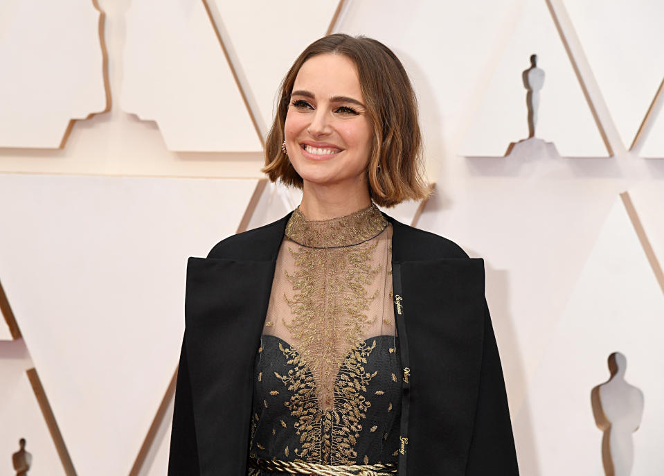 Portman's Dior cape featured the names of female directors. (Photo: Jeff Kravitz/FilmMagic)