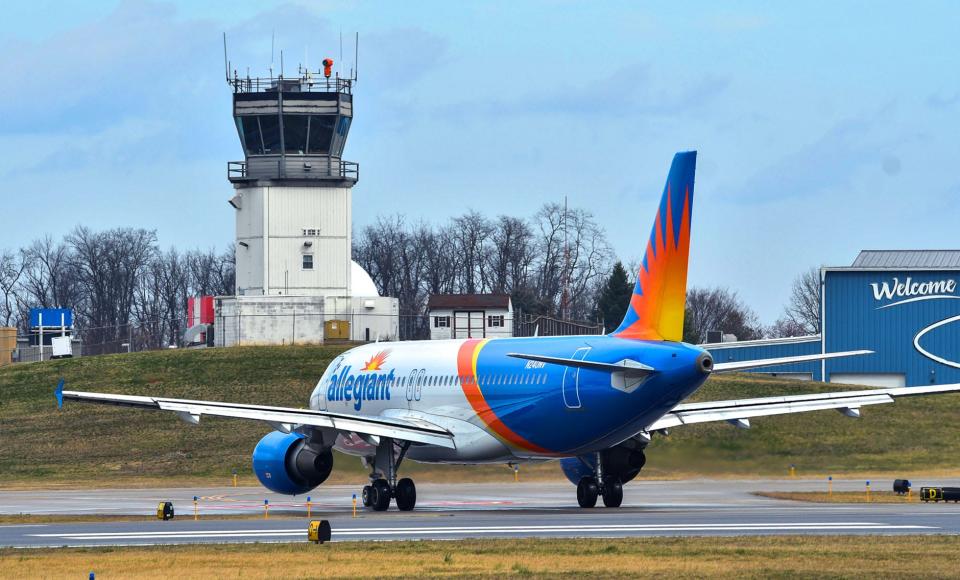 An Allegiant passenger aircraft makes it way to the runway in front of the control tower at Hagerstown Regional Airport. Federal grant money is being sought to build a larger tower.