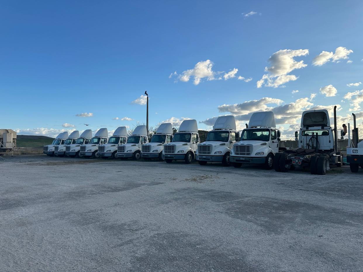 A row of 2016 Freightliner Road tractor trailers line up for Saturday's auction held by the Solid Waste Authority.