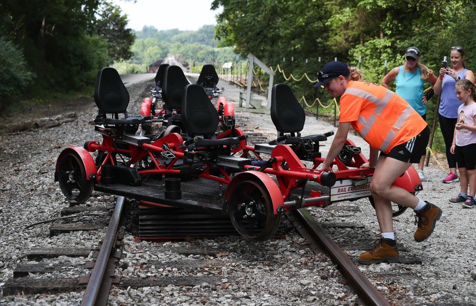 Tour guide Brook Trompler used a turntable to reverse the direction of a railbike for the trip back after riders were treated to a 10-mile round-trip scenic view of bourbon distilleries and horse farms aboard Rail Explorers railbikes in Versailles, Ky. on July 27, 2023.  